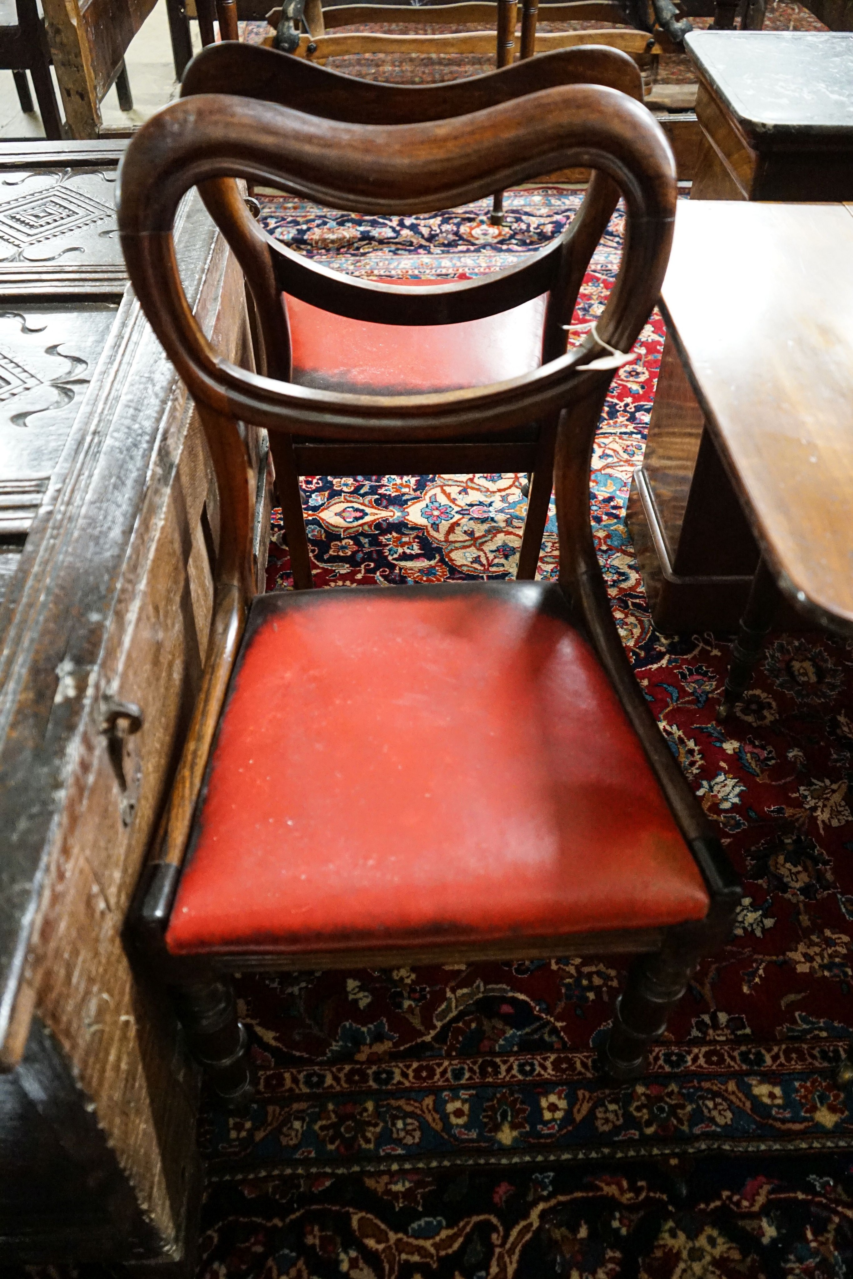 A Victorian mahogany commode cupboard with grey marble top, width 93cm, depth 36cm, height 75cm together with a pair of Victorian rosewood kidney back dining chairs